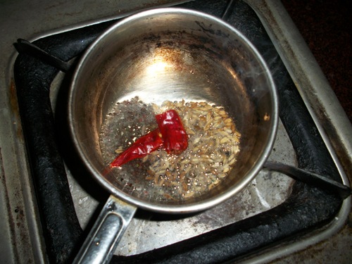 tempering with mustard, cumin and dry red chilles