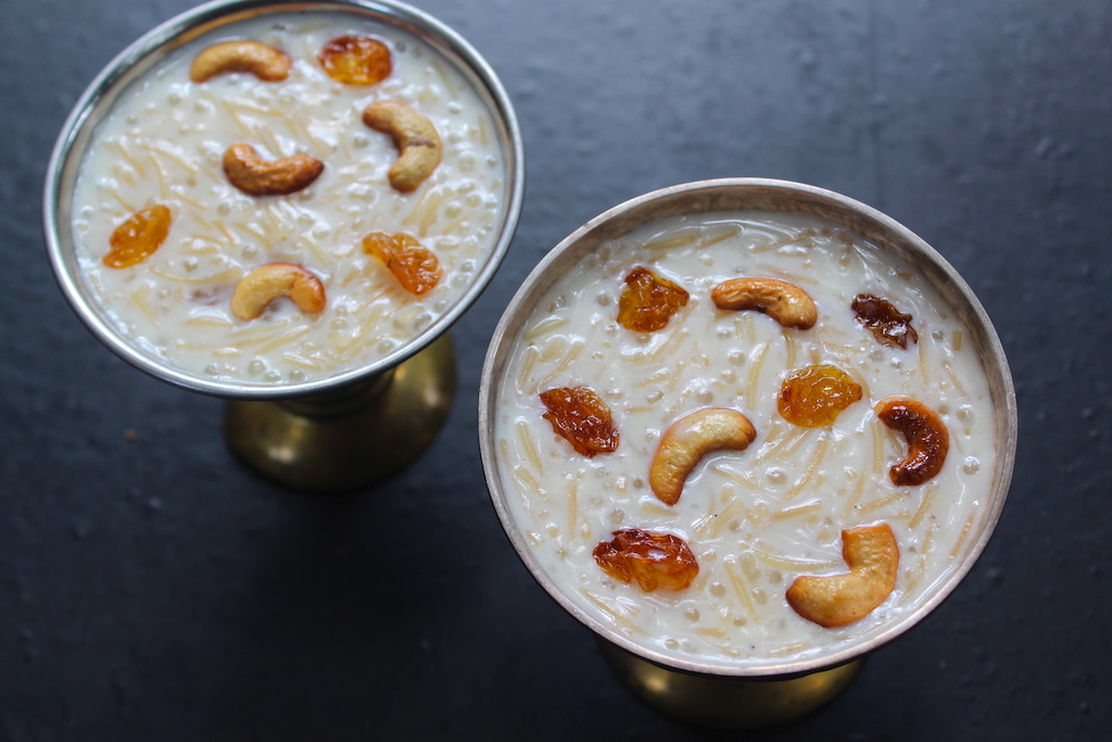 semiya payasam served in two bowls with fried cashews and raisins garnish