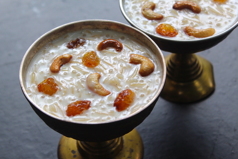 semiya payasam served in two bowls with fried cashews and raisins garnish