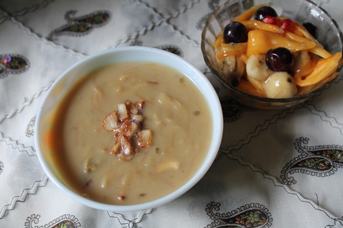 semiya payasam made with jaggery and coconut milk topped with fried coconut garnish