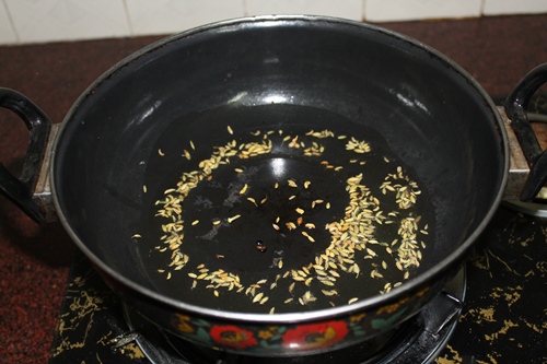 heat oil in a kadai, add in fennel seeds