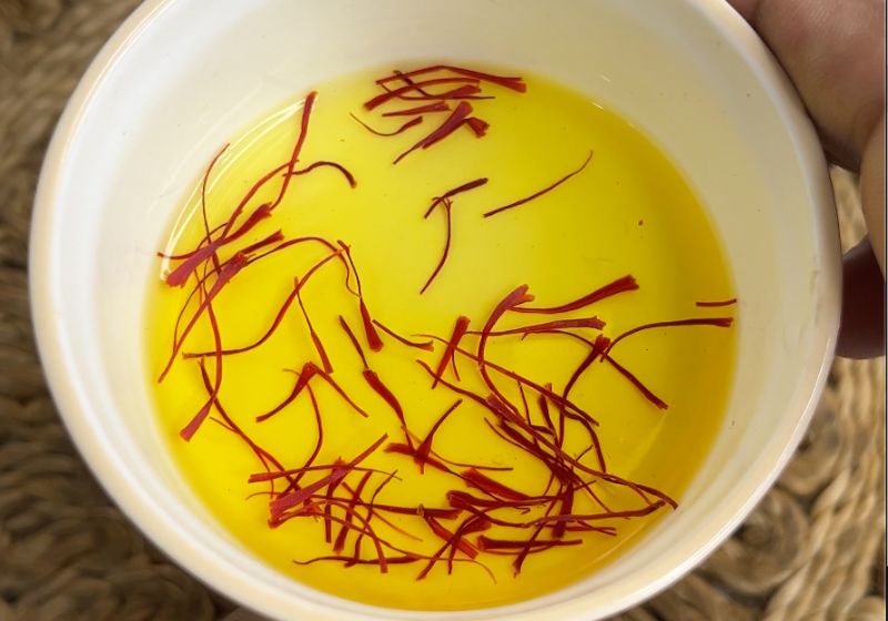 soak saffron in warm water for making badam milk or badam doodh
