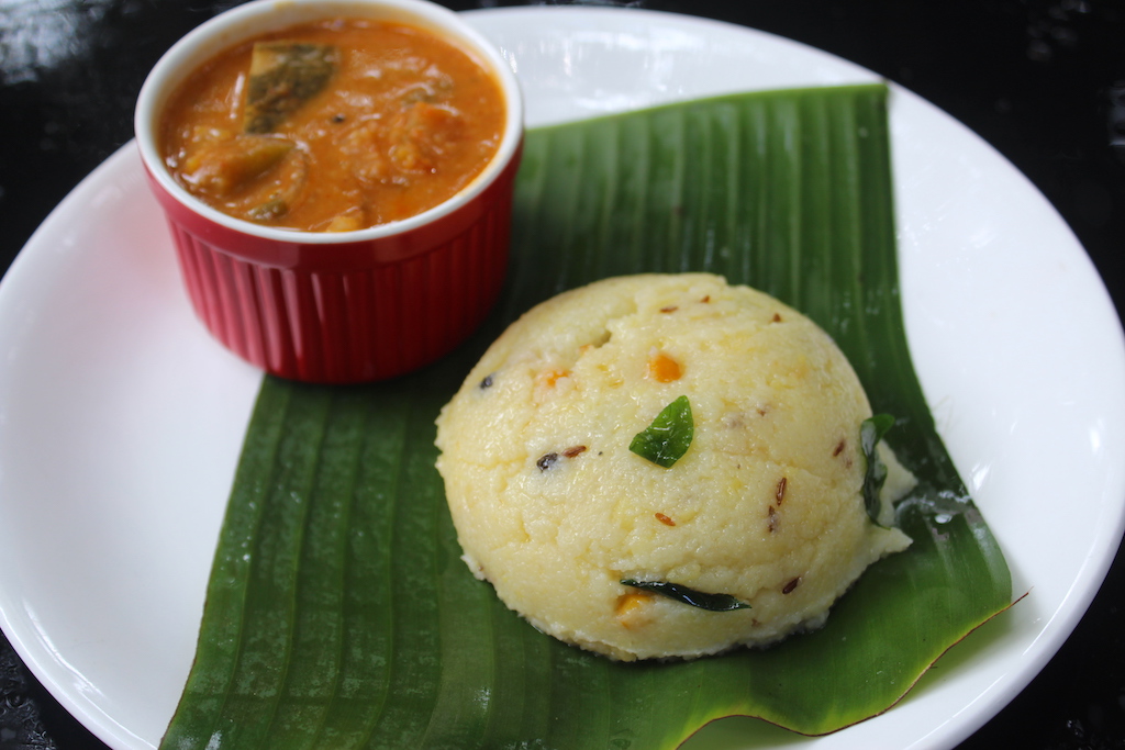rava pongal served in banana leaf with sambar