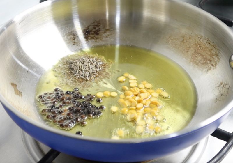 make tempering in ghee. Add in chana dal, pepper and cumin seeds