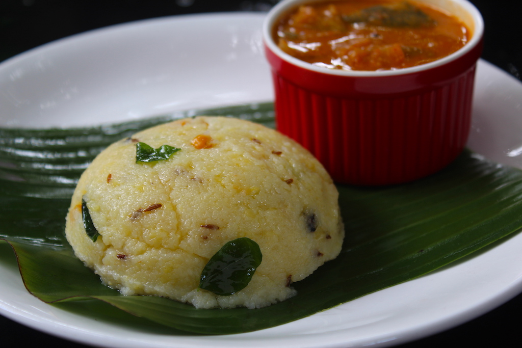 rava pongal served in banana leaf with sambar