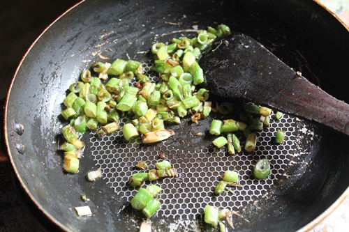 saute spring onion in oil for making chicken cutlets