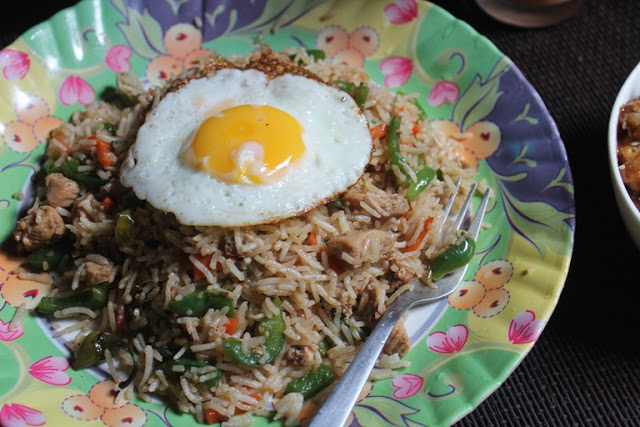 chicken fried rice served with a fried egg