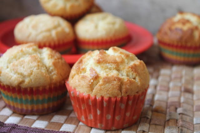 vanilla muffins with perfect muffin tops stacked on a red plate