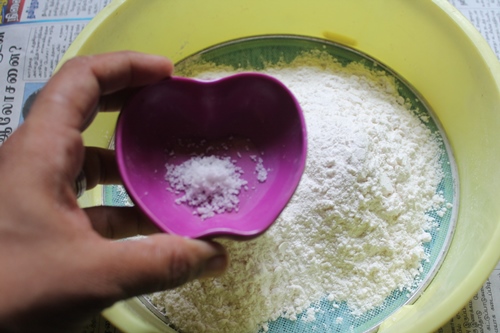 salt added to plain flour which is in a sieve