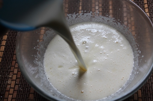 milk is added to whipped eggs and sugar