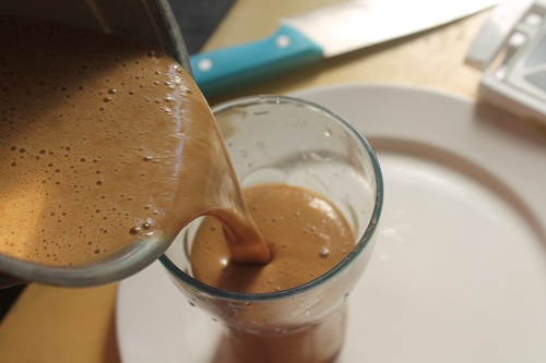 pour smoothie in a serving cup