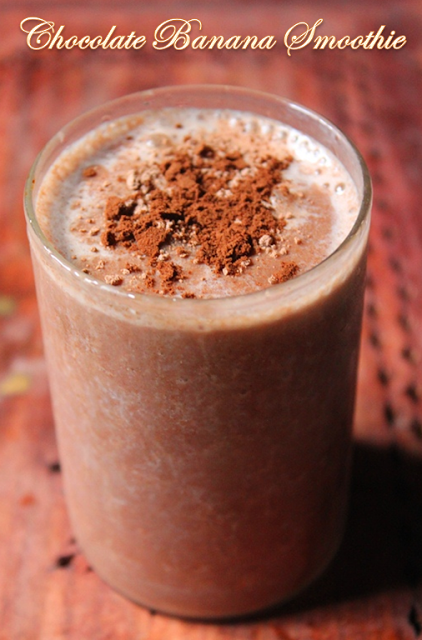 Chocolate Banana Smoothie in a cup with a sprinkle of cocoa powder on top.