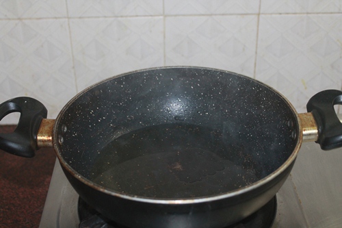 heat oil in a kadai