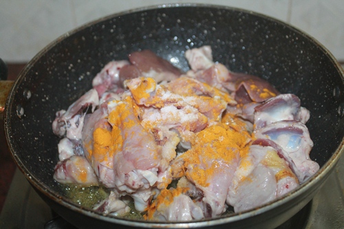 add chicken, salt, turmeric, ginger and garlic