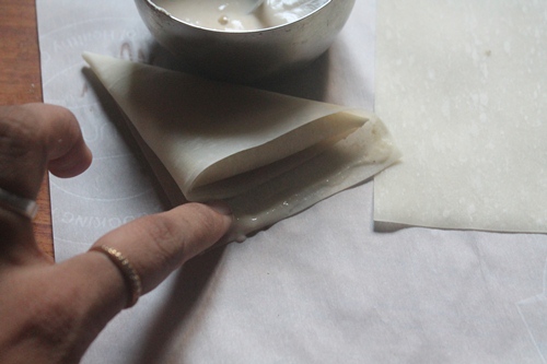 stick to edges of the samosa sheet