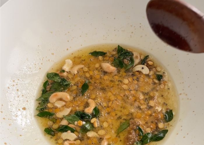 tempering spices in hot oil for rava kichadi