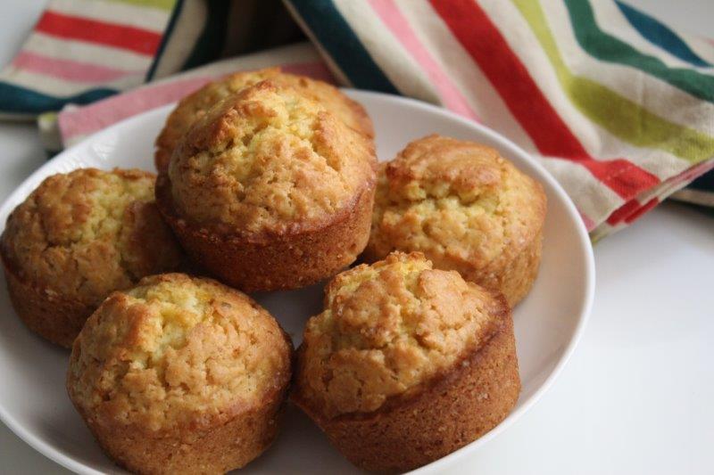 orange muffins displayed on a white plate