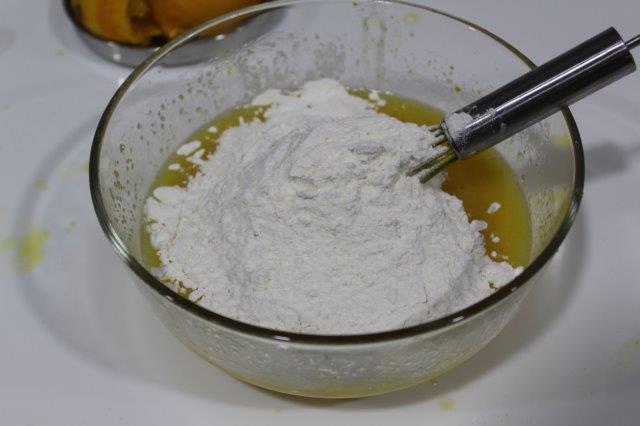 add in plain flour to the wet orange mix