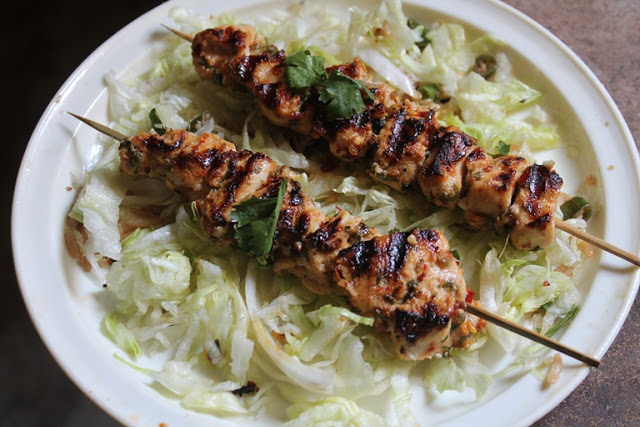 Chicken Kebab in skewer placed over a bed of shredded lettuce