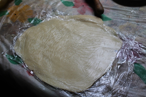 roll another pastry into thin sheet