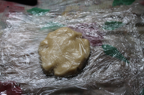 cover pastry dough with another sheet of plastic wrap