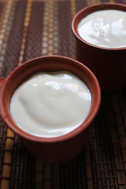 two terracotta cup of curd