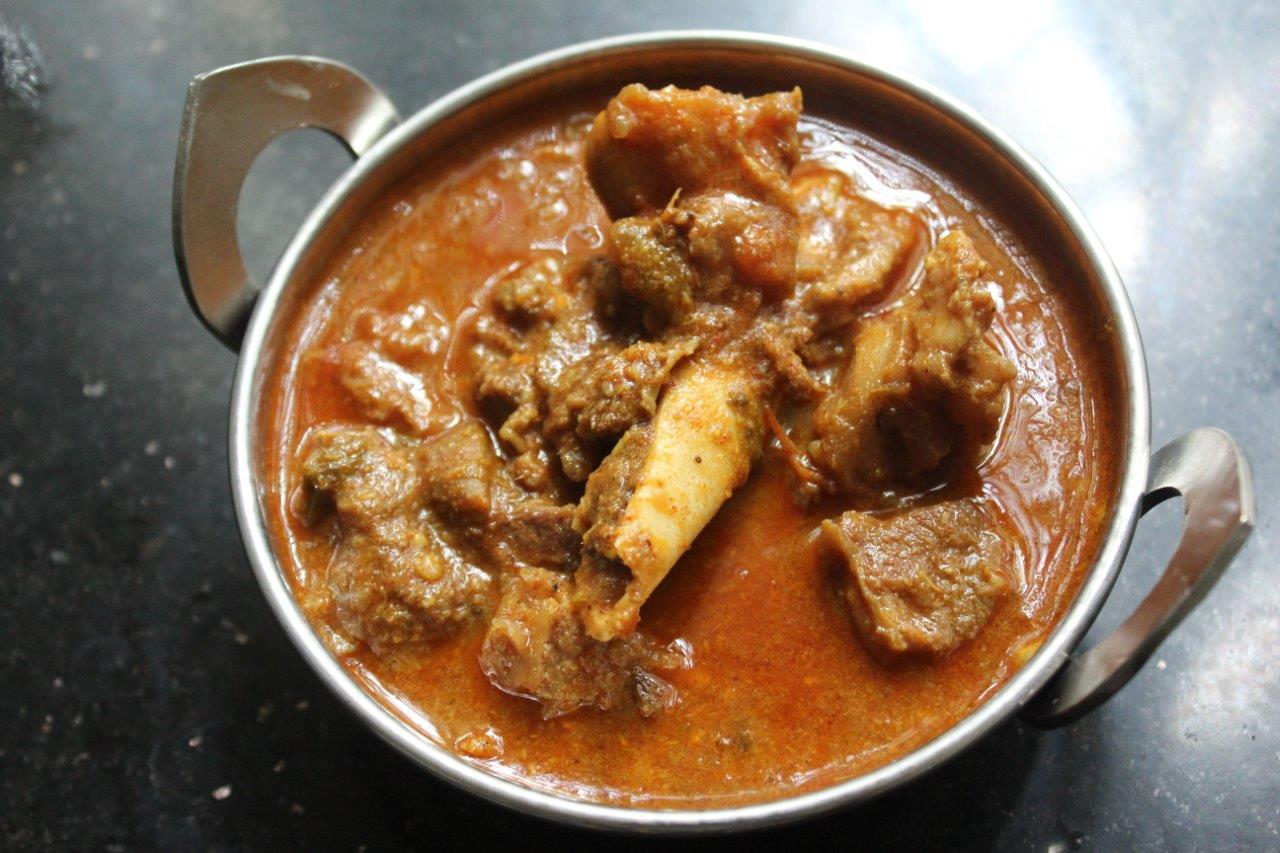 spicy mutton kuzhambu or mutton kulambu served in a bowl