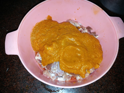 add ground masala to mutton pieces
