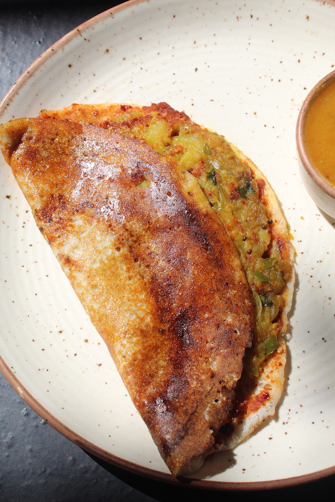 mysore masala dosa served with chutney and sambar close shot