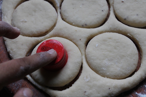 cut doughnuts using a bottle lid