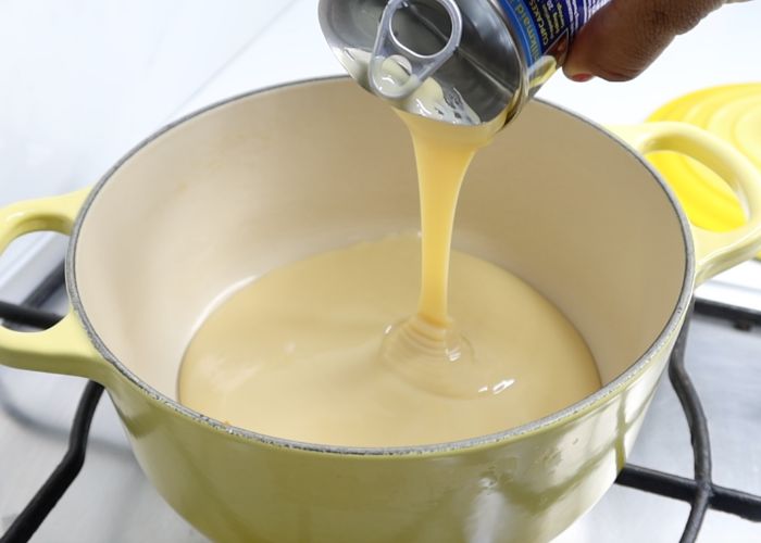 pour sweetened condensed milk in a pan