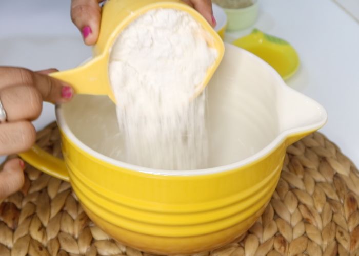 take flour in a bowl for making dough