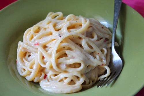 serve white sauce pasta on a plate