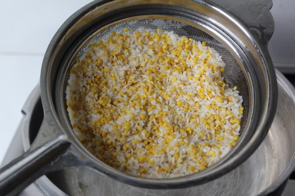 add rice to roasted dal and wash well