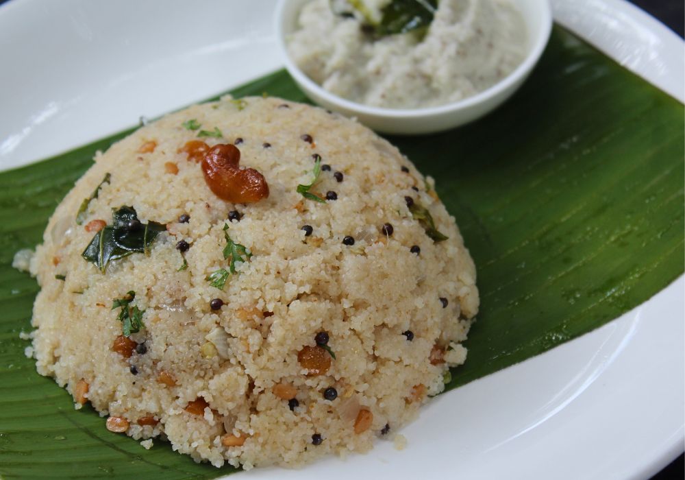 upma served in banana leaf with coconut chutney