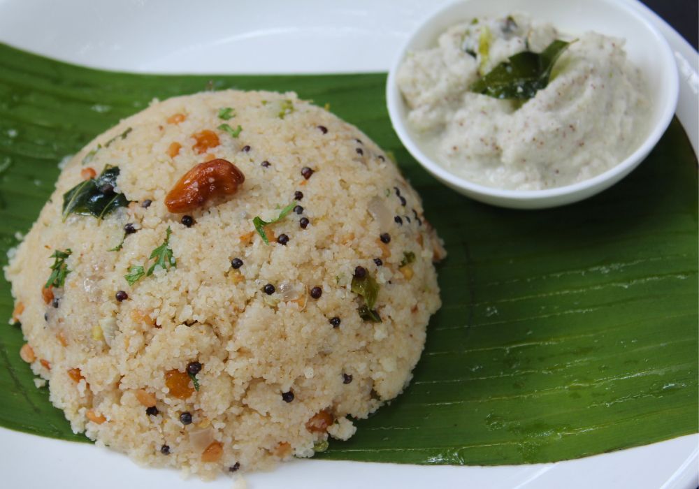 upma served in banana leaf with coconut chutney