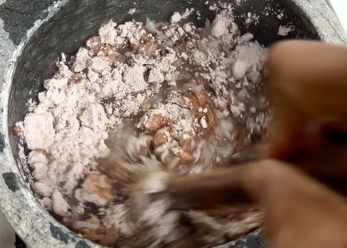 mix ragi flour with wooden stick
