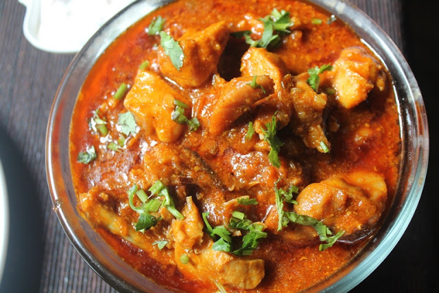 chicken gravy served with rice and roti