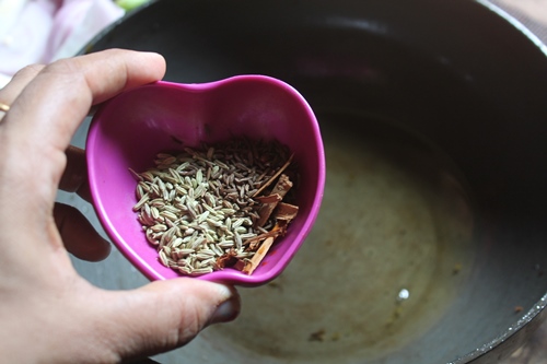 heat oil in a kadai. Add in whole spices