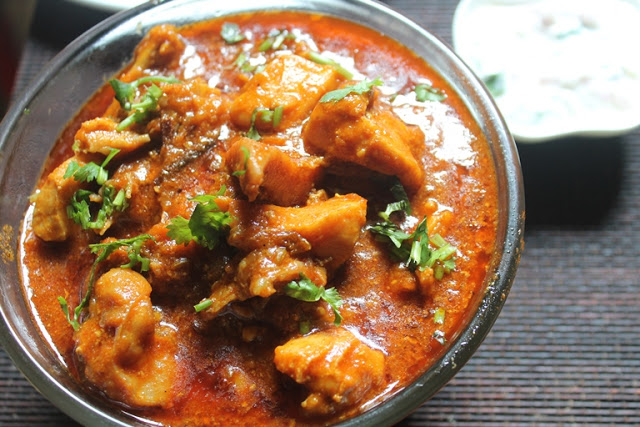 chicken gravy served with rice and roti