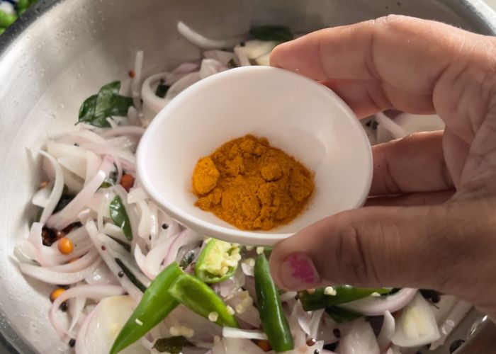 add turmeric powder for colour