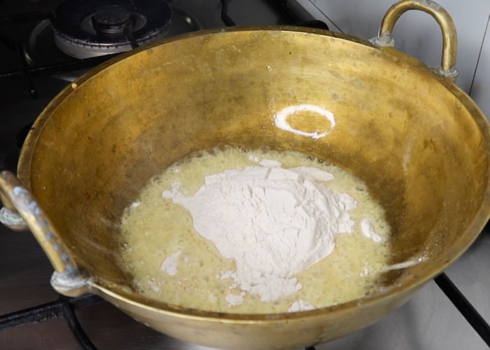 add wheat flour into the kadai