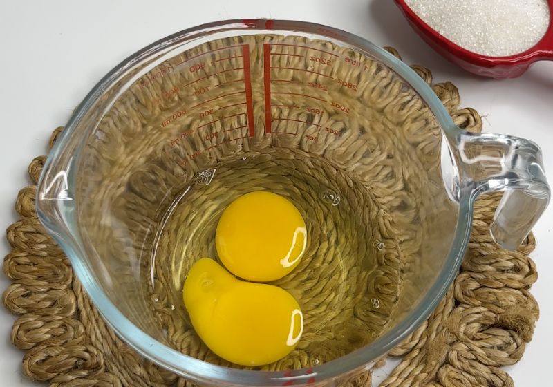 for making caramel custard take eggs in a bowl