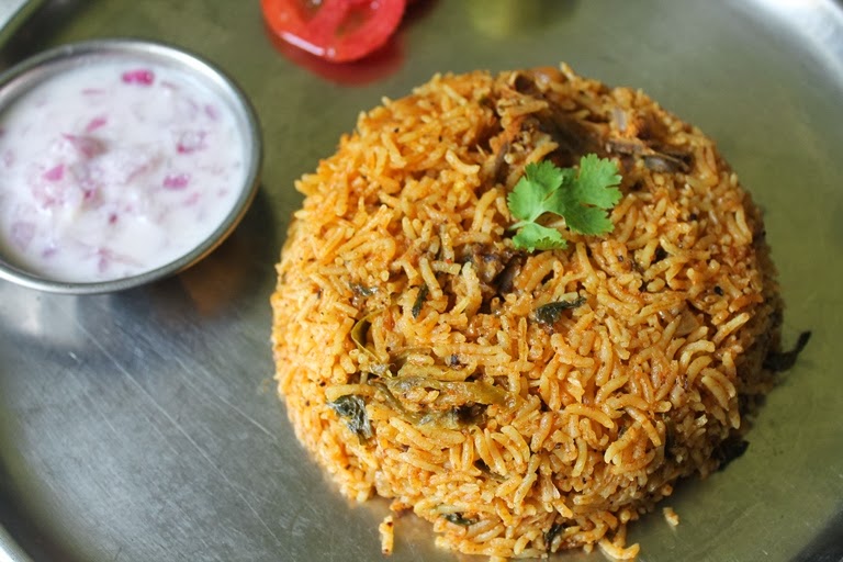 chicken biryani served with onion raita