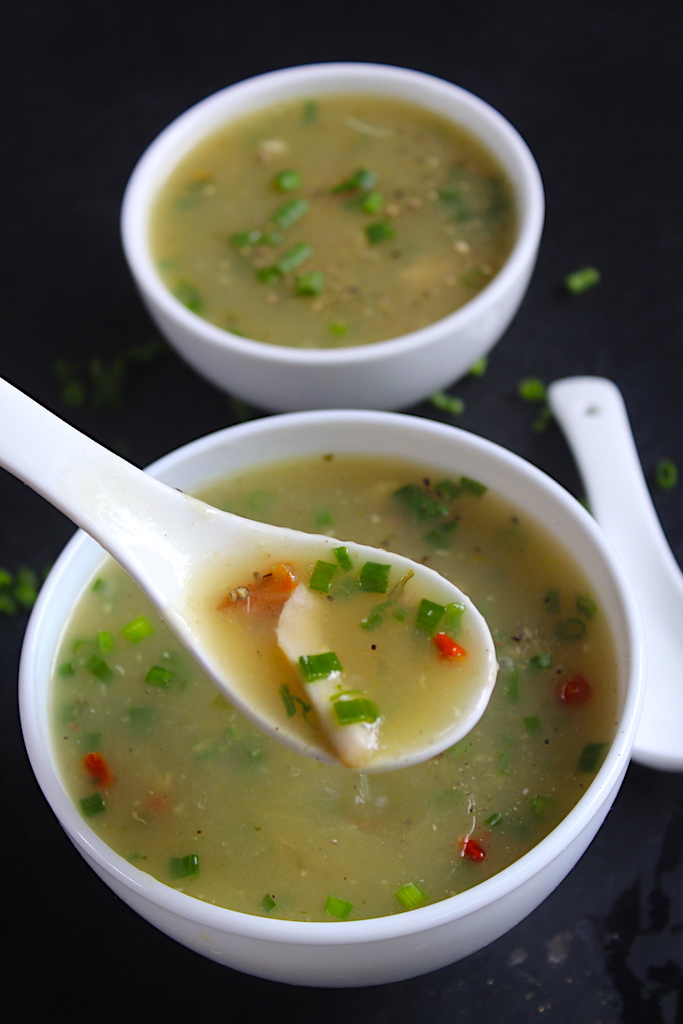 chicken clear soup in a soup spoon