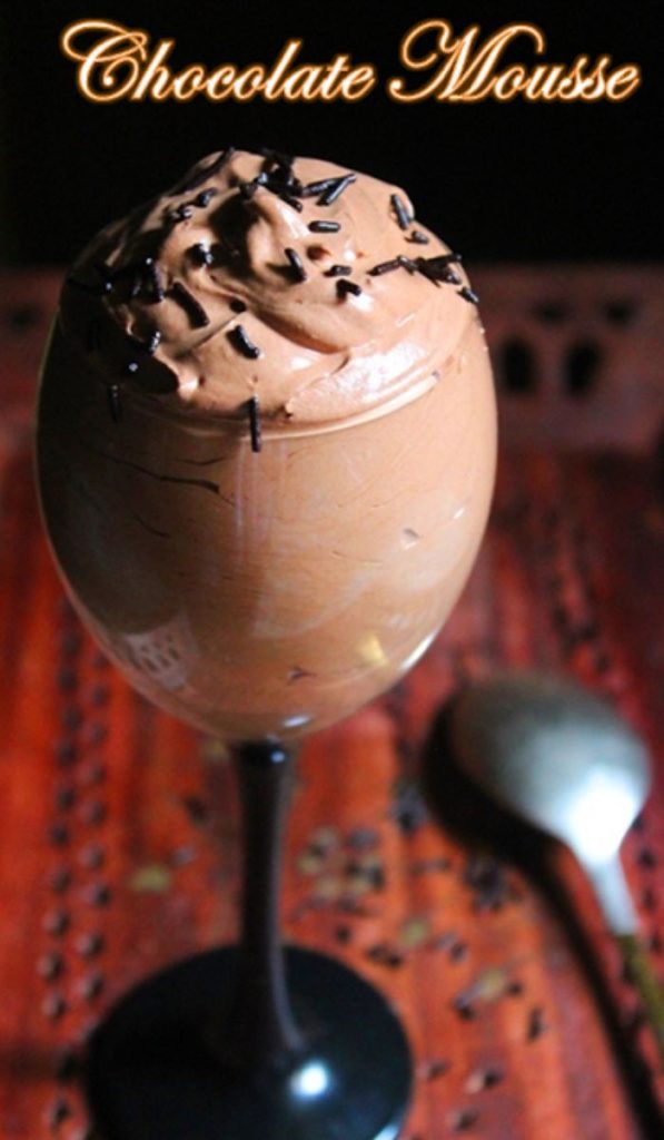 eggless chocolate mousse served in a stem glass with chocolate sprinkles on top