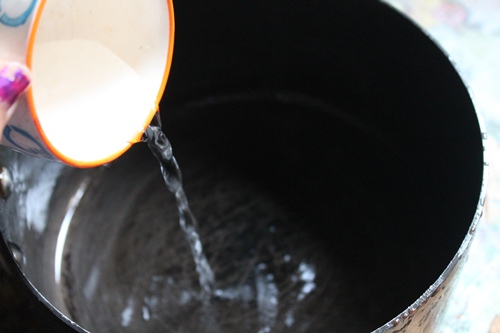 take water in a sauce pan for melting chocolate