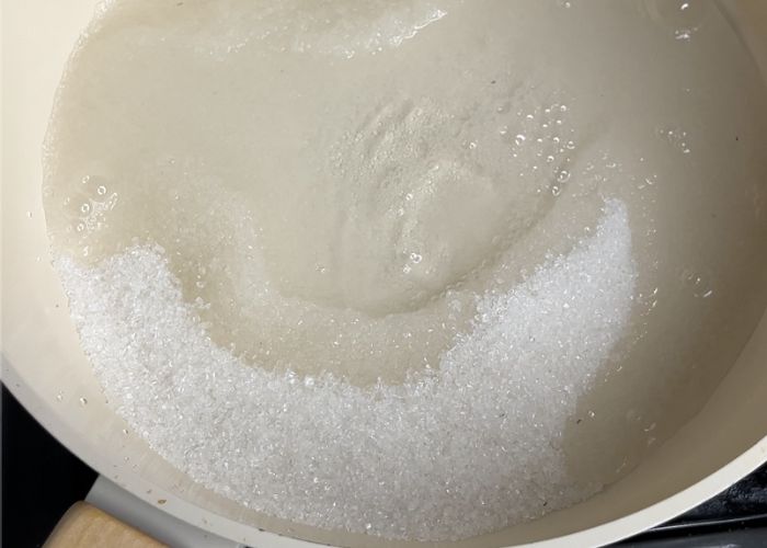 take sugar water in a pan