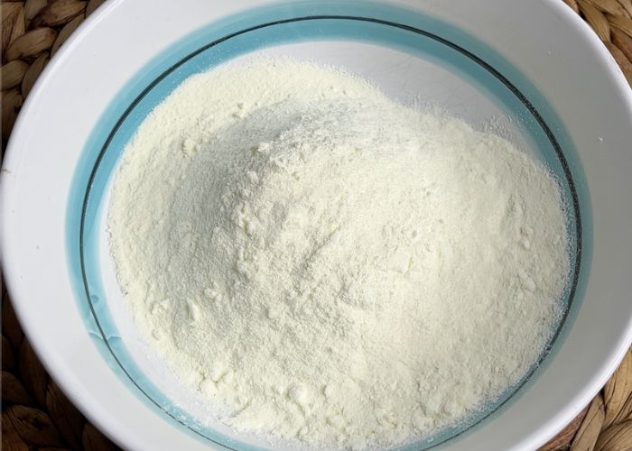 take milk powder in a bowl