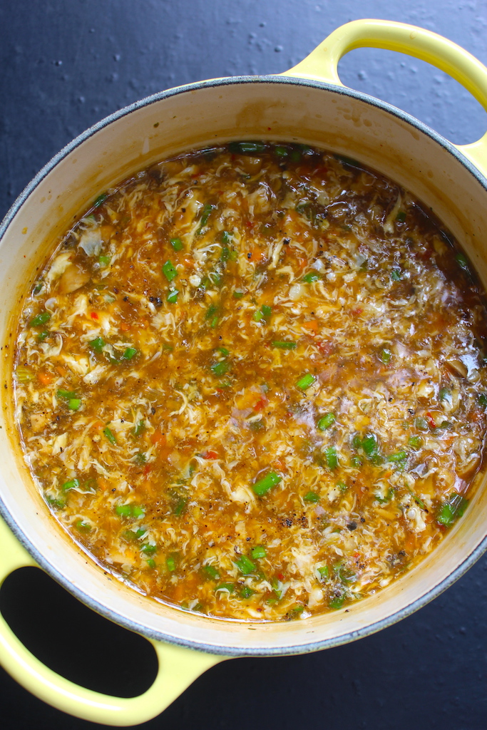 Hot and Sour Chicken Soup served in yellow casserole